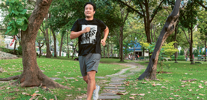 Asian man running (photo)