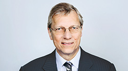 John R. Coomber – Member, non-executive and independent (photo)