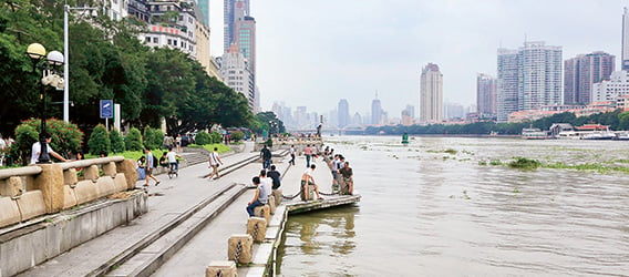 People gather along the banks of the Pearl River in Guangzhou, Guangdong Province, China. (photo)