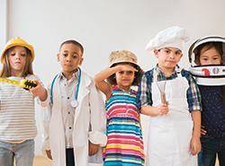 A group of children dressed as different professionals (photo)